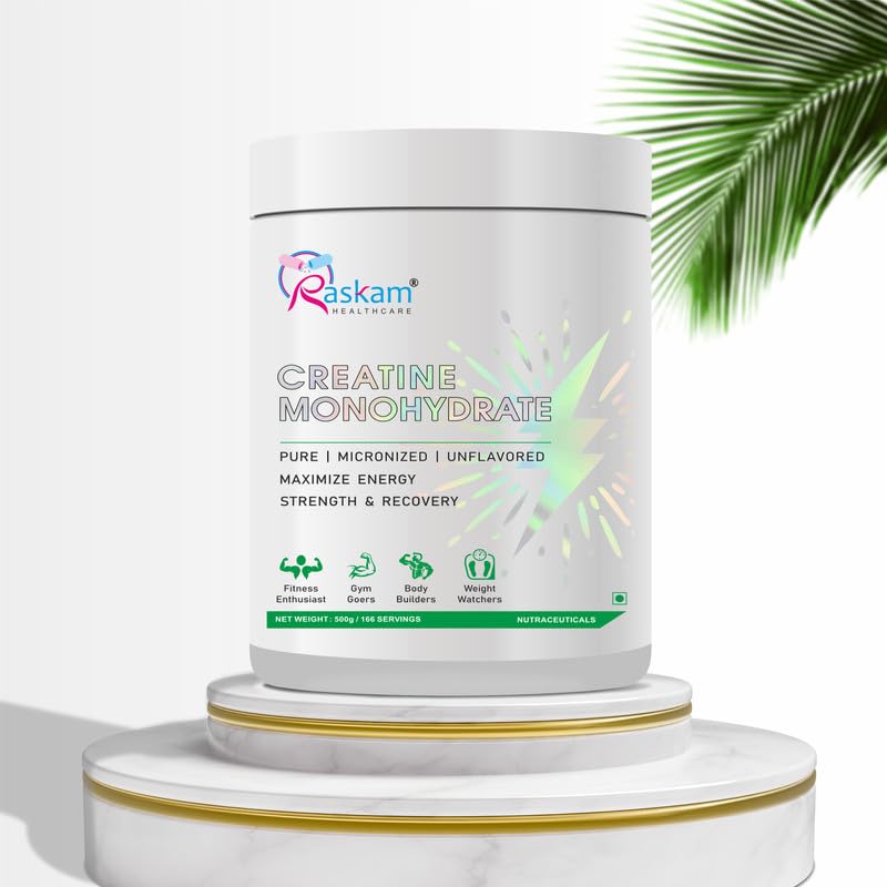 Container of Raskam Creatine Monohydrate on a white background with green leaves.