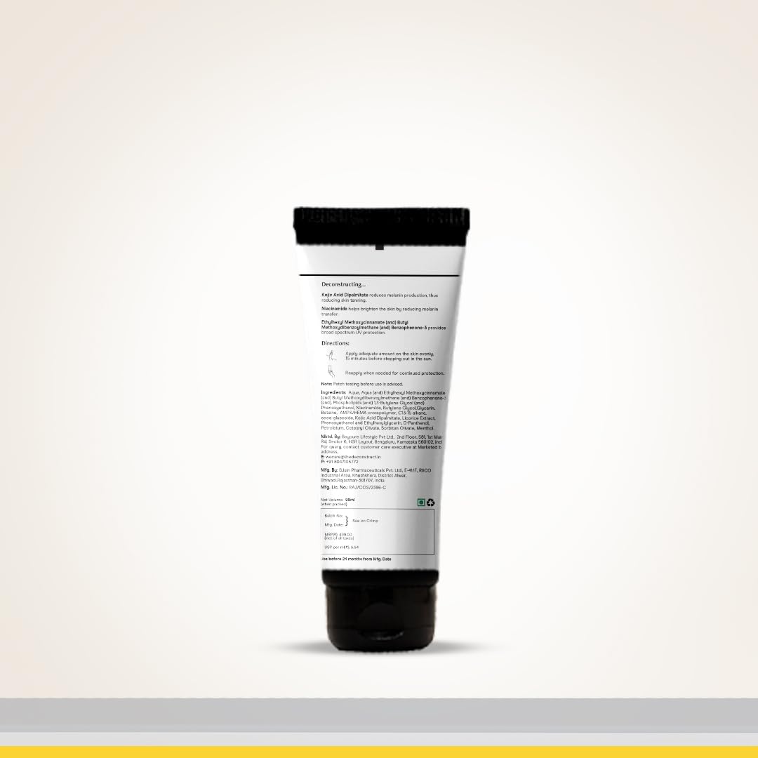 Tube of cream with a black cap on a light gray background