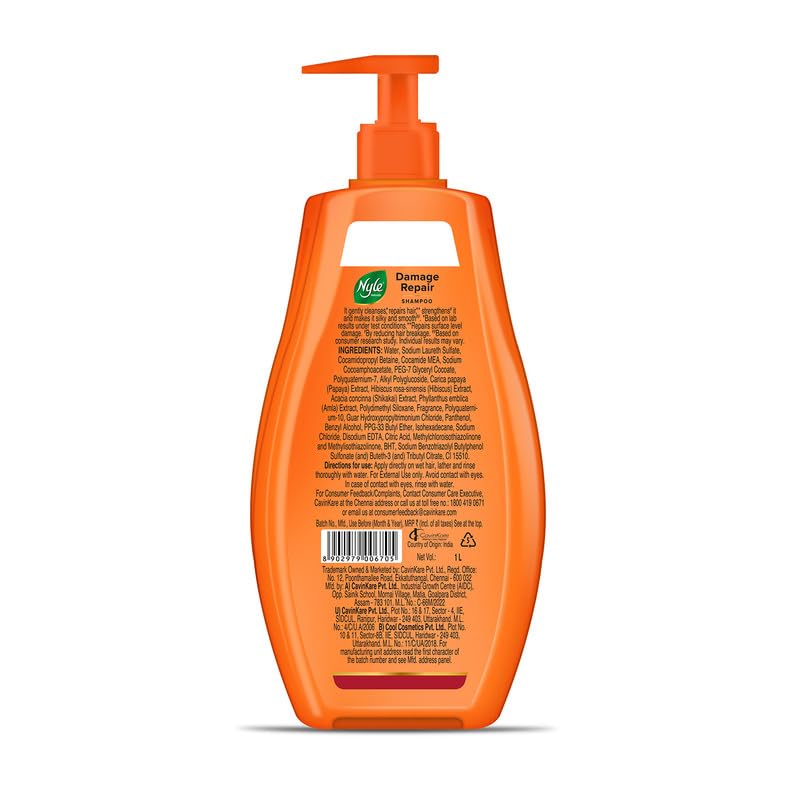 Orange shampoo bottle with pump on a white background