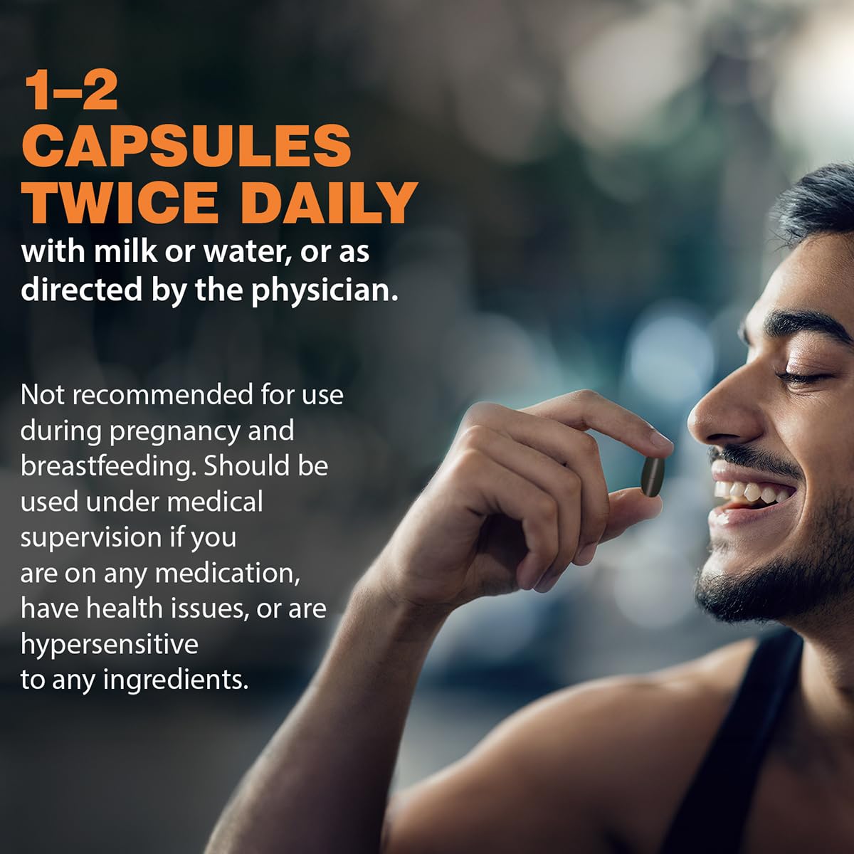 Man holding a capsule with text about daily medication dosage and usage instructions.