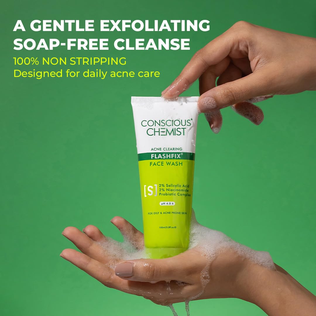 Hand holding a tube of 'Conscious Chemist' face wash with green background