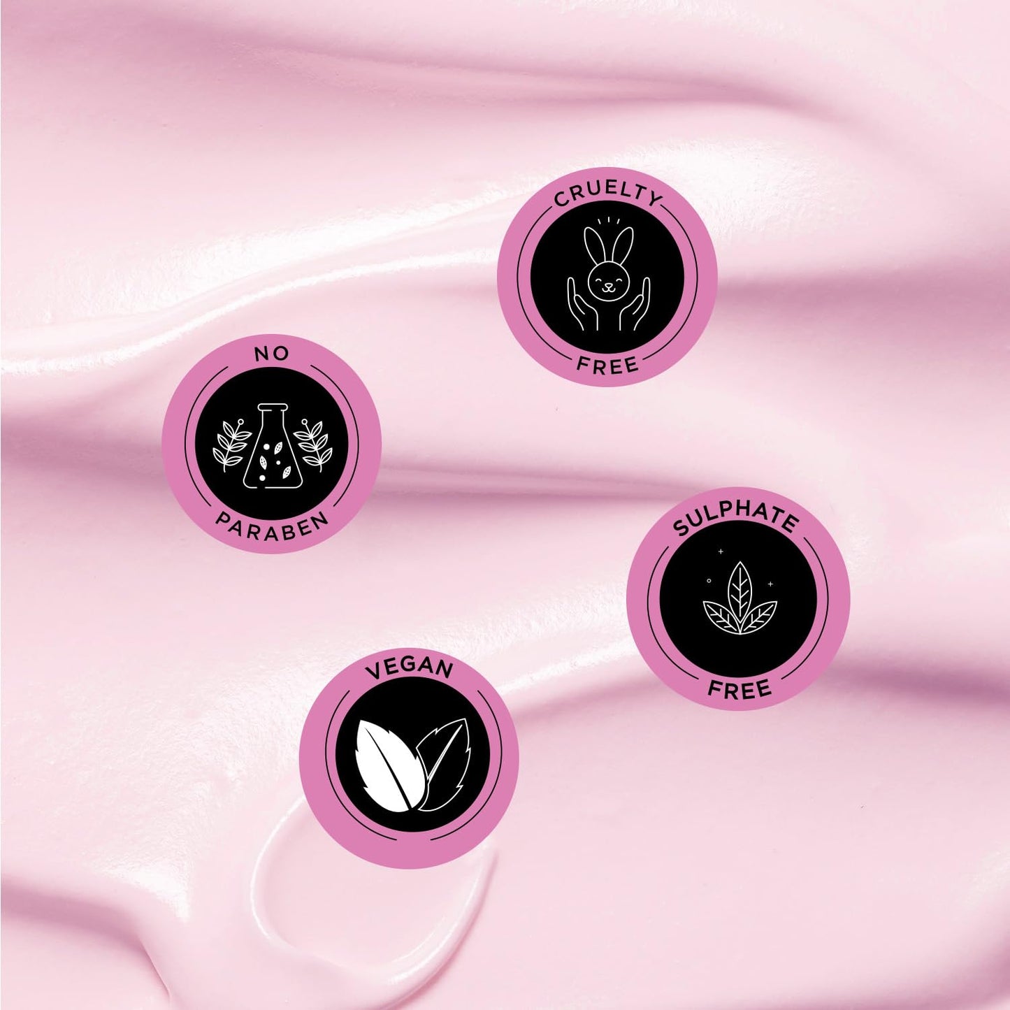 Set of four pink circular icons with black text and symbols on a pink fabric background