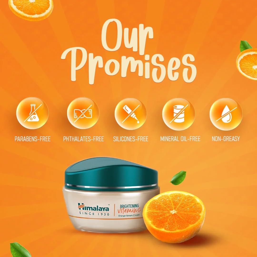Himalaya Brightening Vitamin C Cream with orange slices on an orange background