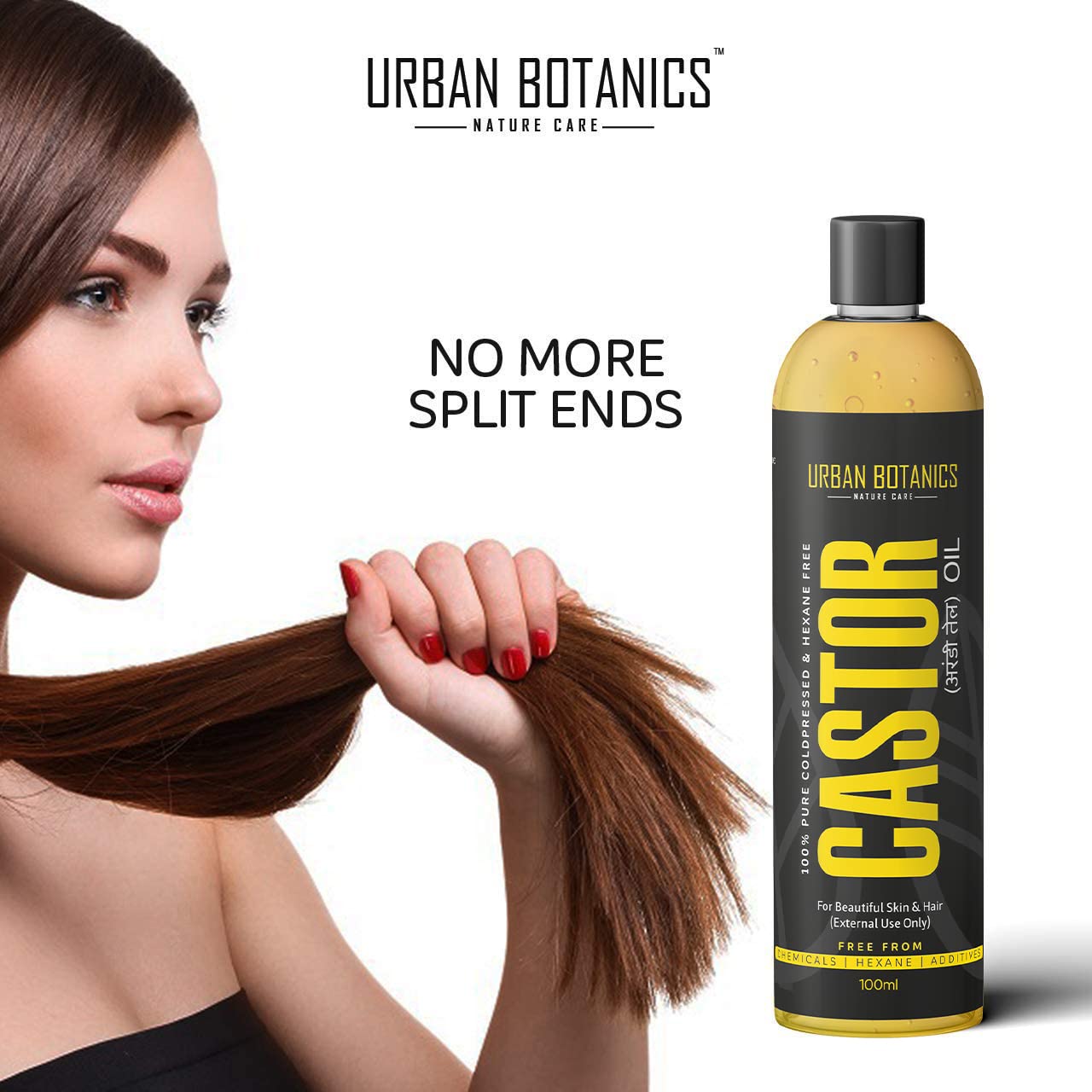 Woman holding hair with Urban Botanics Castor oil bottle on a white background