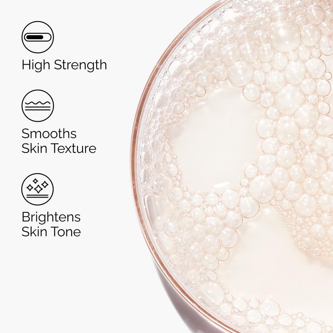 Close-up of a bowl with bubbles and text highlighting product benefits on a white background