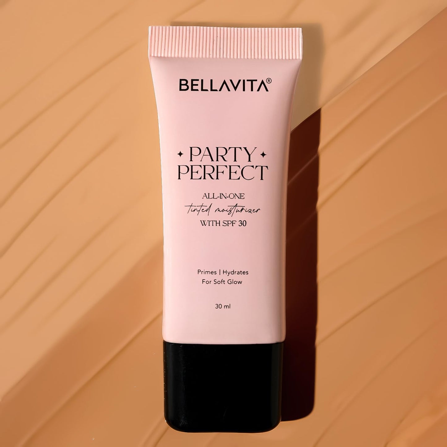 Bellavita Party Perfect skincare tube on a warm brown background