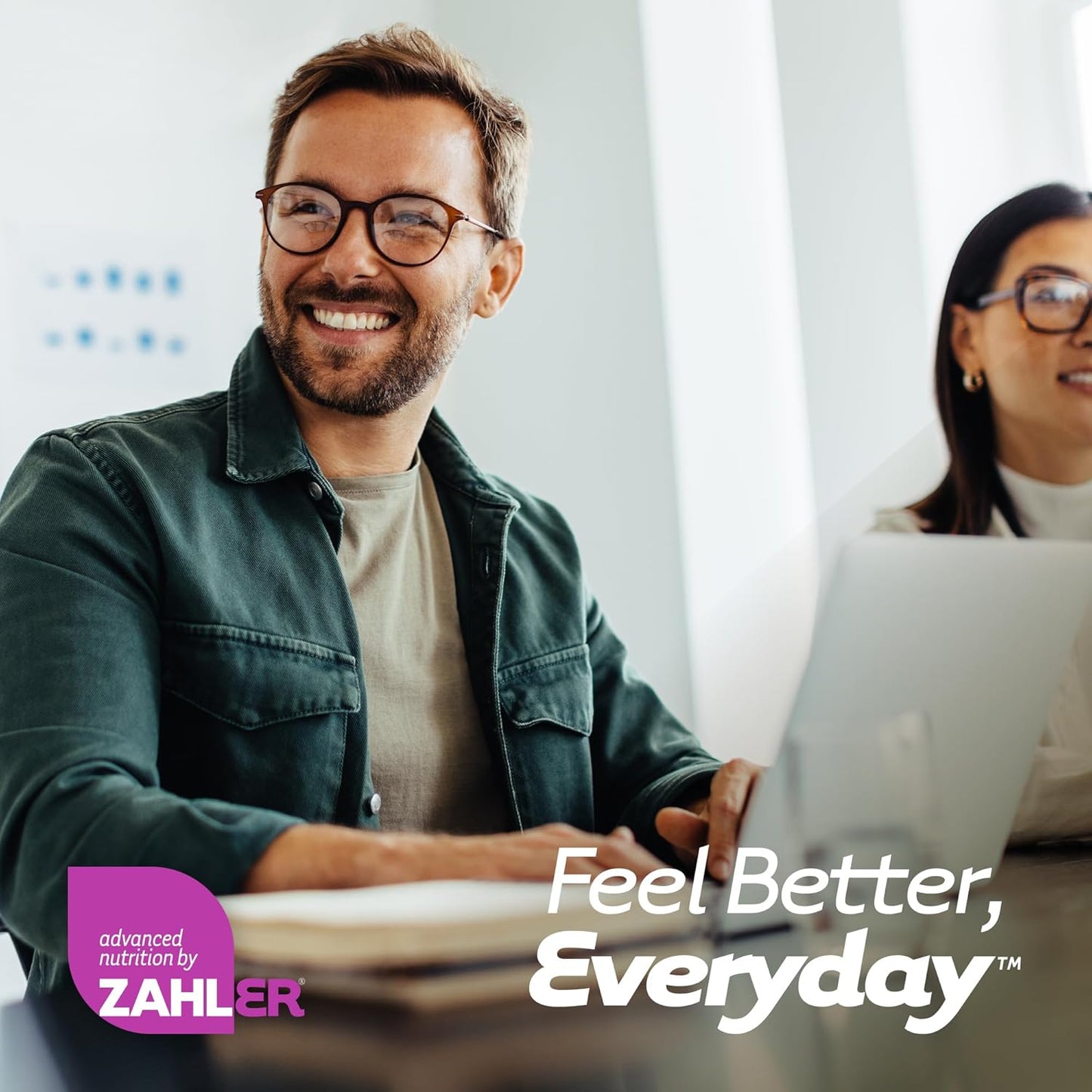 Two people working on a laptop with 'Feel Better, Everyday' text and Zahler logo.