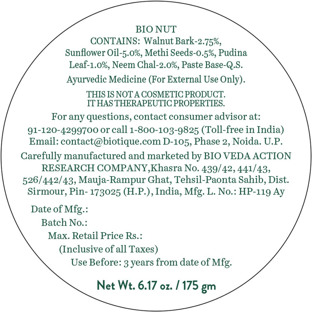 Round label with text containing product details and manufacturing information on a white background