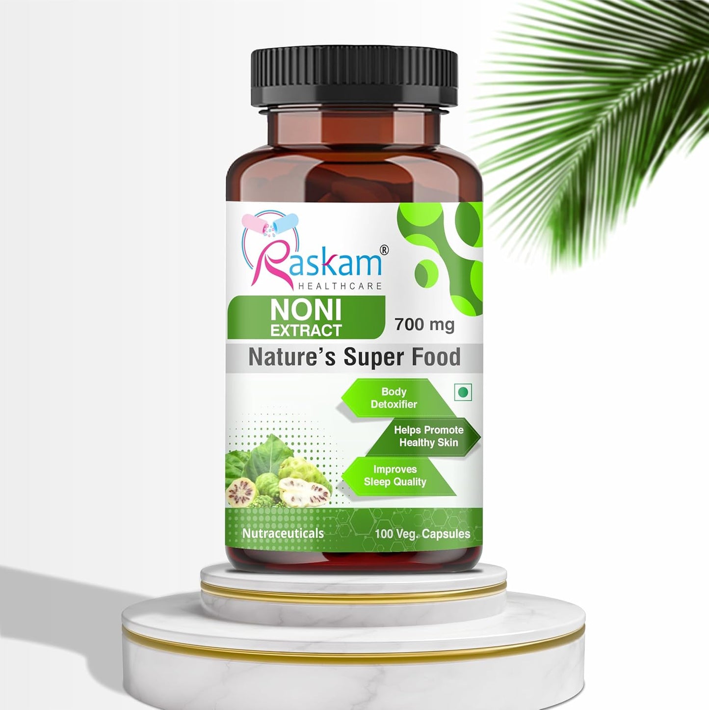 Bottle of Raskam Noni Extract on a white background with green leaves.