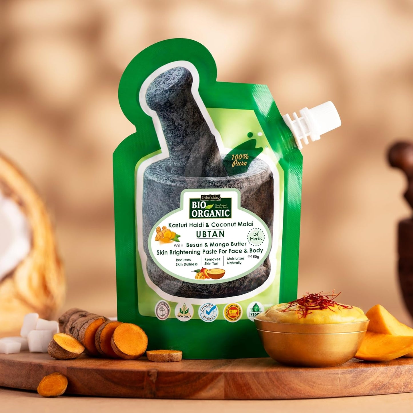 Green packaging of Bio Organic Ubtan with a wooden background