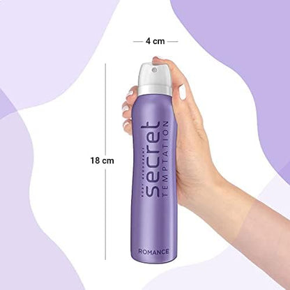 Hand holding a purple deodorant spray bottle labeled 'Secret Temptation Romance' with measurements on a light purple background.