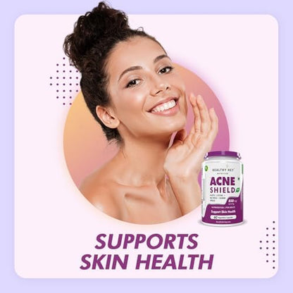 Woman with clear skin holding a bottle labeled 'Acne Shield' against a light purple background.