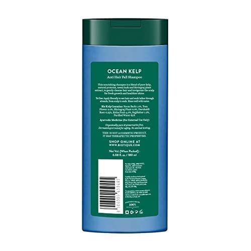 Shampoo bottle with green label on a white background