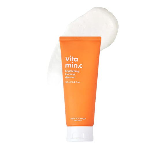 Orange tube of 'vita min.c' cleanser with white cap on a white background