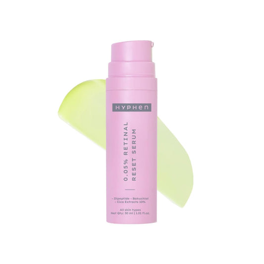 Pink serum bottle with 'Hyphen' branding on a white background