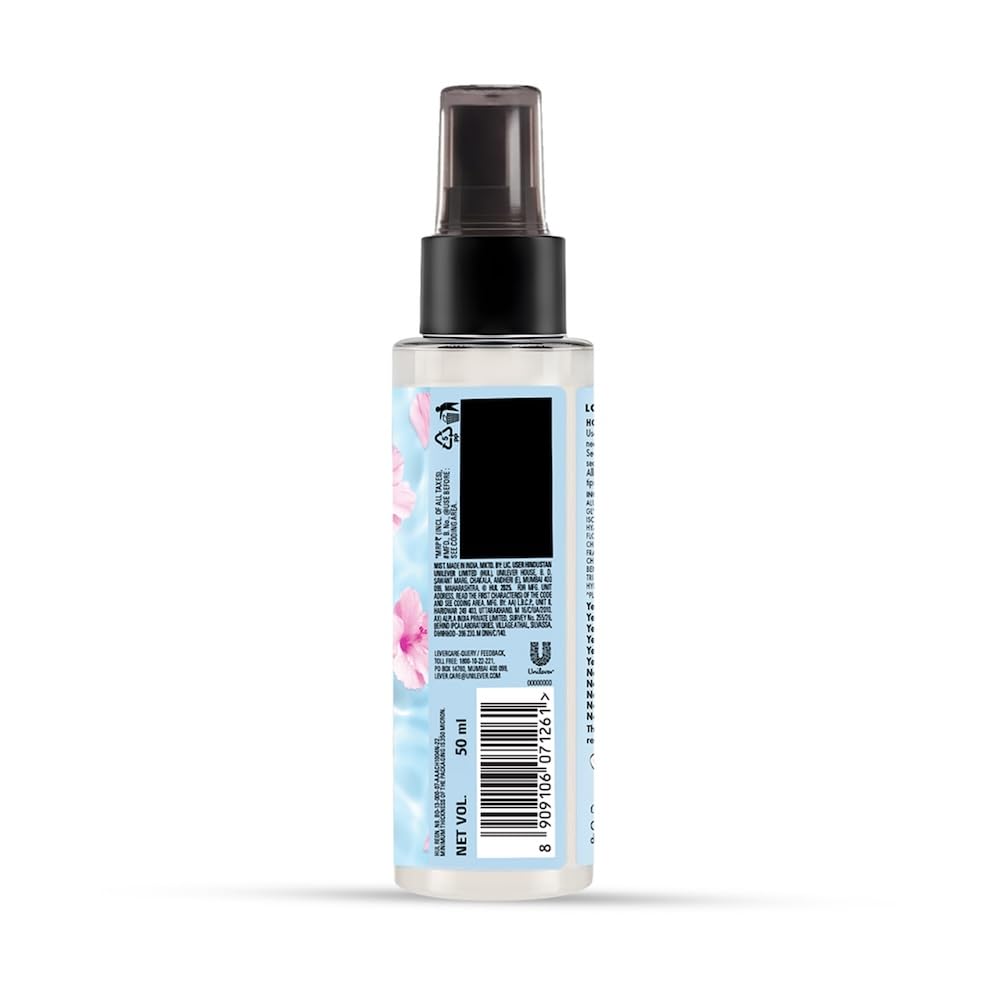 Spray bottle with a colorful label on a white background
