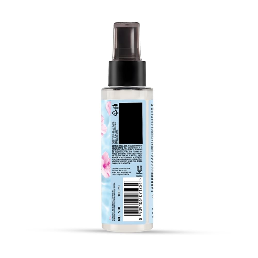 Spray bottle with a colorful label on a white background