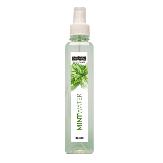 Mint water facial toner spray bottle with a white label on a white background
