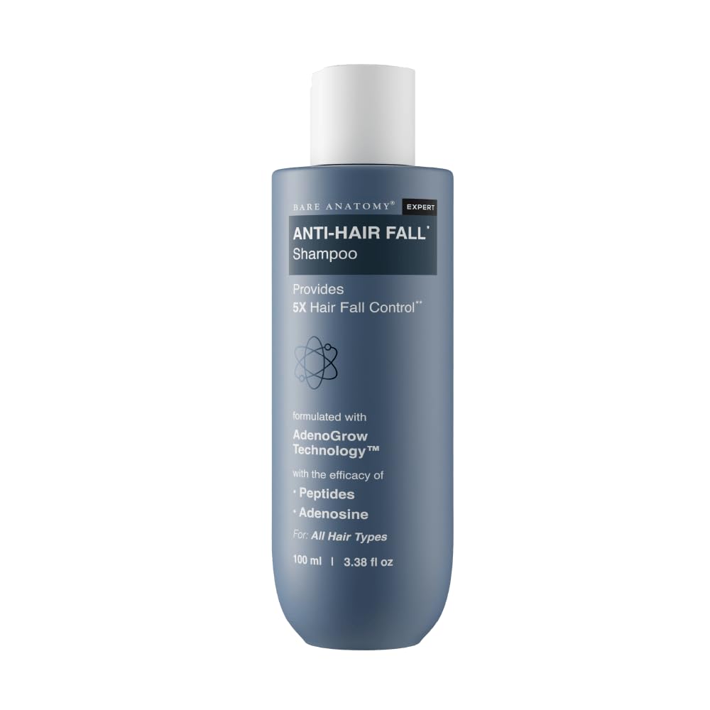 Blue shampoo bottle with white cap on a white background