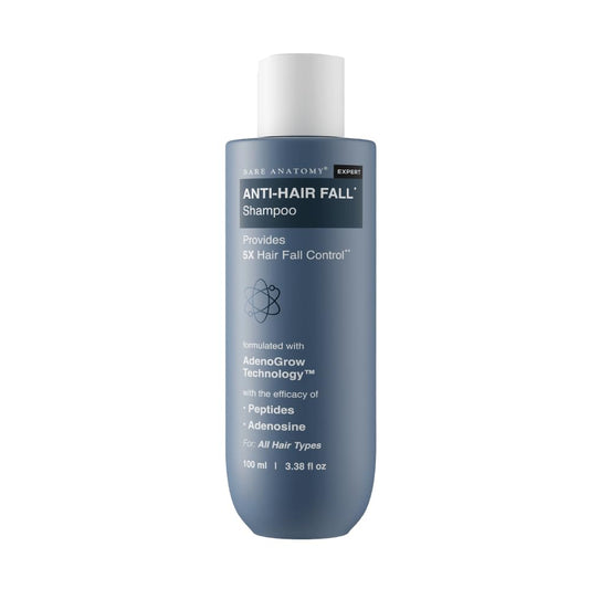 Blue shampoo bottle with white cap on a white background