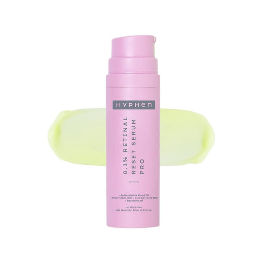 Pink serum bottle with 'Hyphen' branding on a white background