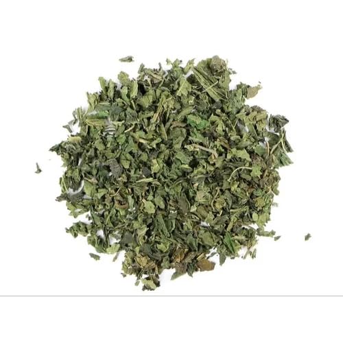 Dried green herbs on a white background