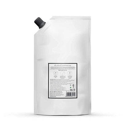 White refillable container with a label on a white background