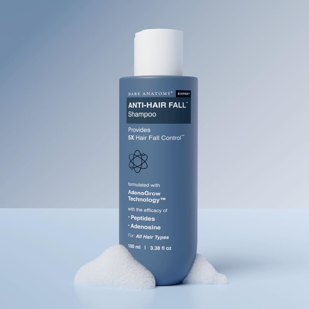 Bottle of Anti-Hair Fall Shampoo on a light blue background