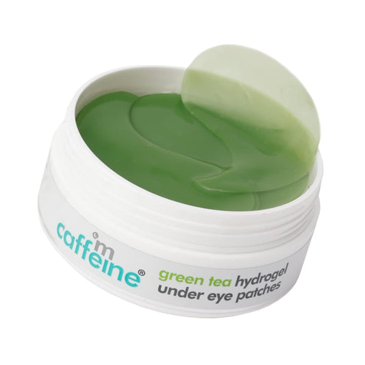 Caffeine green tea hydrogel under eye patches in a container on a white background