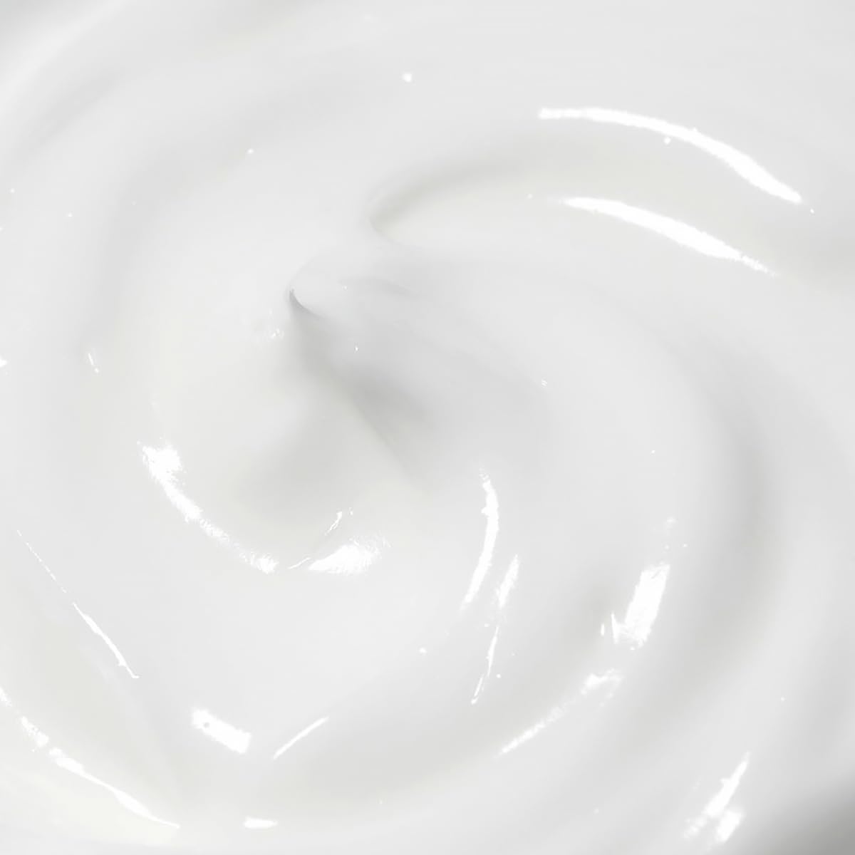 Close-up of a white ceramic bowl with light reflections