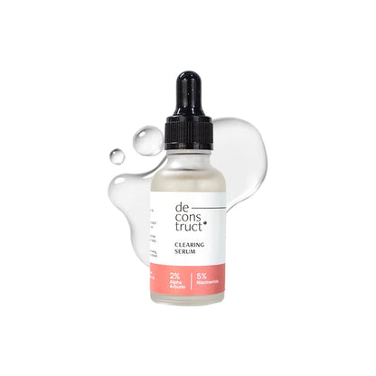 Clear serum bottle with dropper labeled 'de construct' on a white background