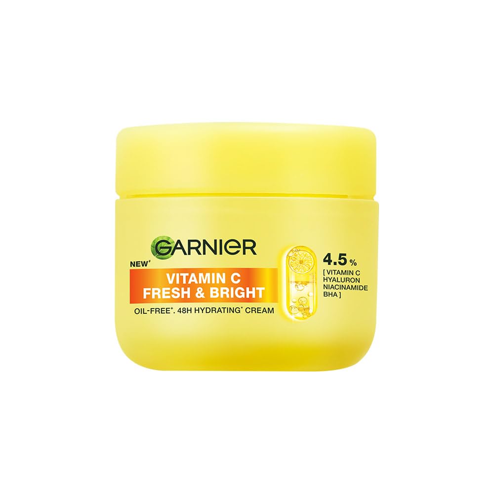 Yellow jar of Garnier Vitamin C Fresh & Bright cream on a white background