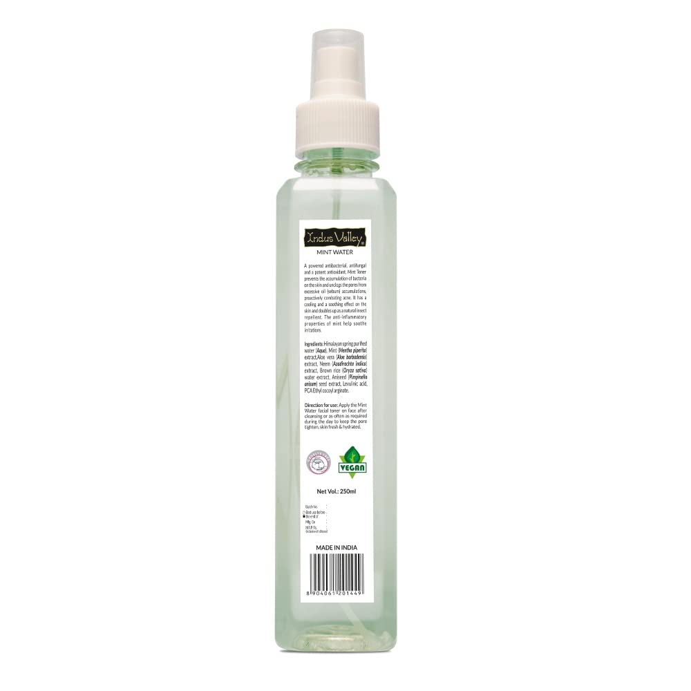 Clear spray bottle with a label on a white background