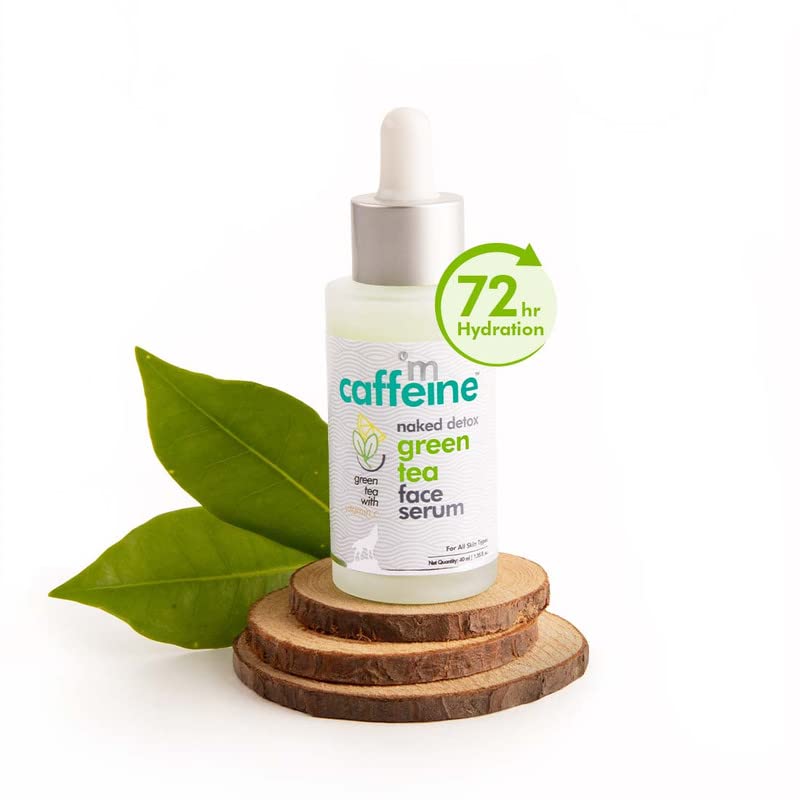 Green tea face serum bottle with dropper on a white background