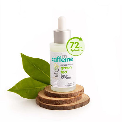 Green tea face serum bottle with dropper on a white background