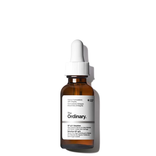 Brown glass bottle with white cap labeled 'The Ordinary' on a white background