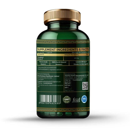 Green supplement bottle with gold cap on a white background