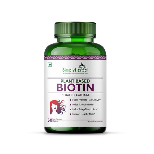 Green bottle of Simply Herbal Plant Based Biotin supplement on a white background