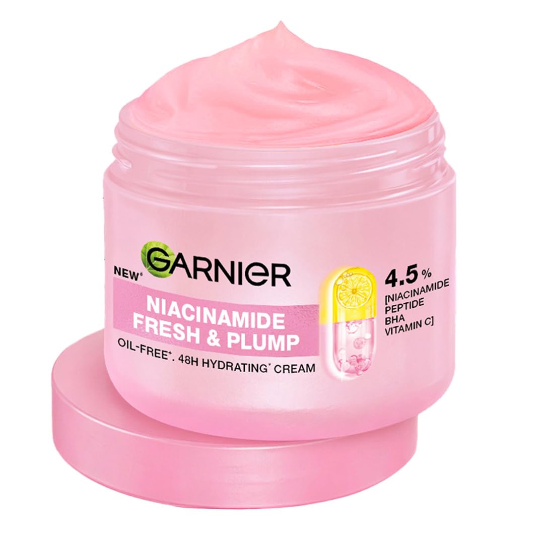 Pink jar of Garnier Niacinamide Fresh & Plump cream on a white background