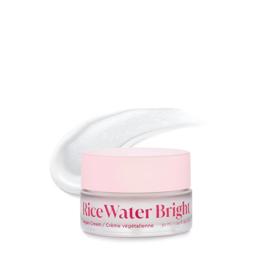Jar of Rice Water Bright cream with pink lid on a white background