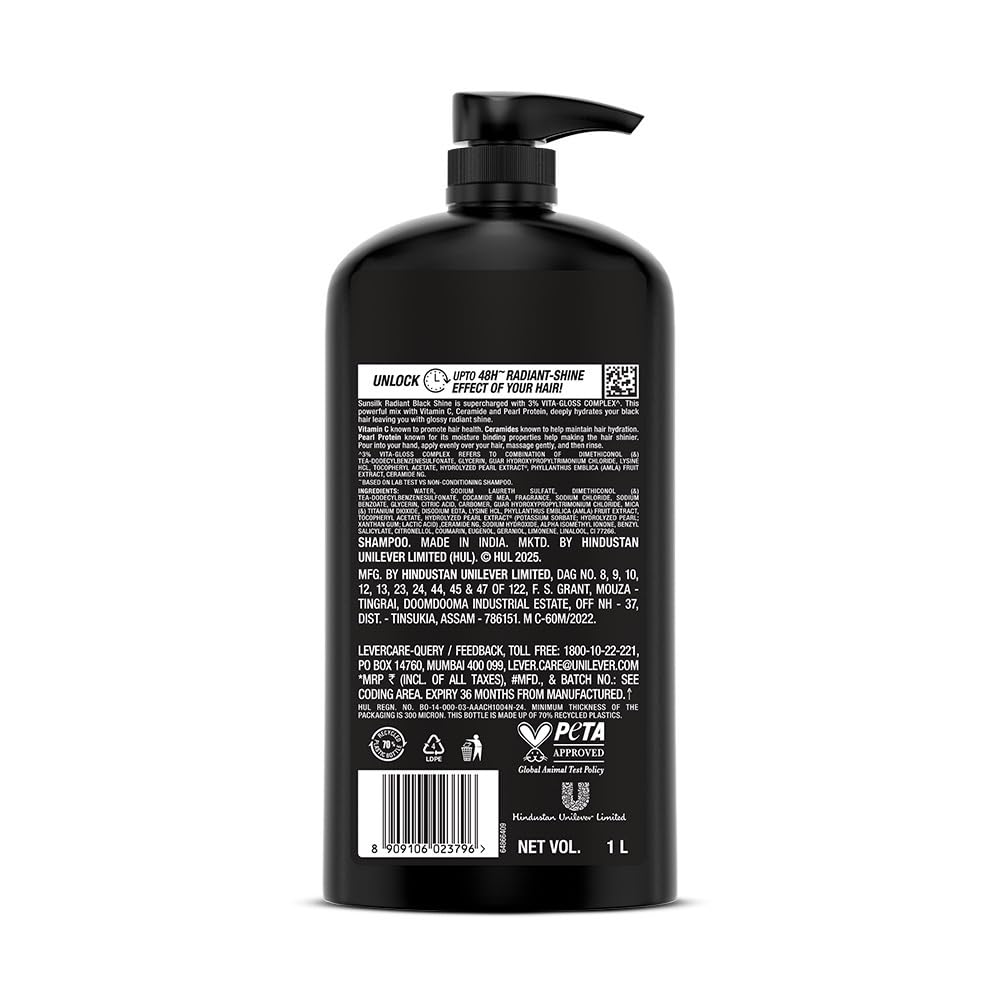 Black shampoo bottle with pump on a white background
