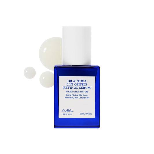 Blue bottle of DRAiTHEA 0.1% Gentle Retinol Serum with white capsules on a white background
