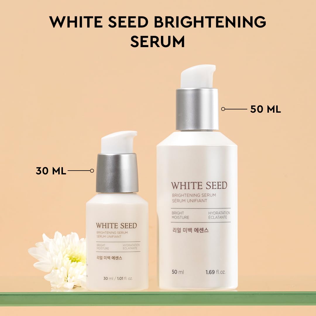 Two bottles of White Seed Brightening Serum with labels indicating volume on a beige background.