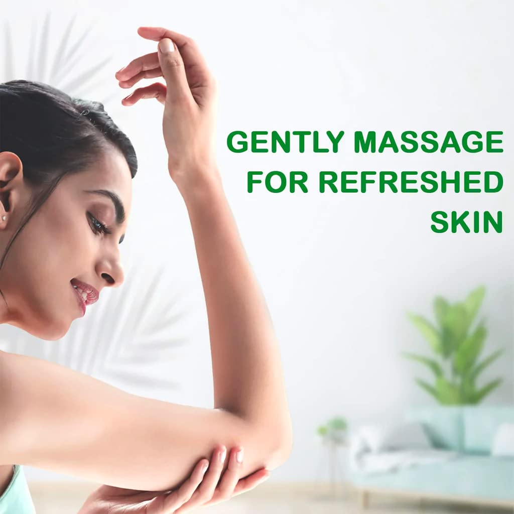 Woman massaging her arm with text 'Gently Massage for Refreshed Skin' on a blurred background