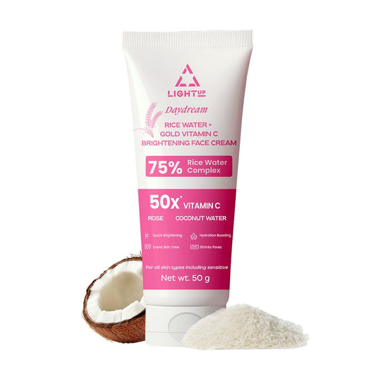 Tube of Daydream cream with coconut and rice on a white background