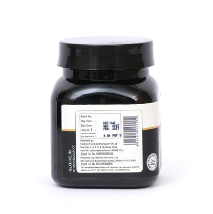 Black jar with a label on a white background