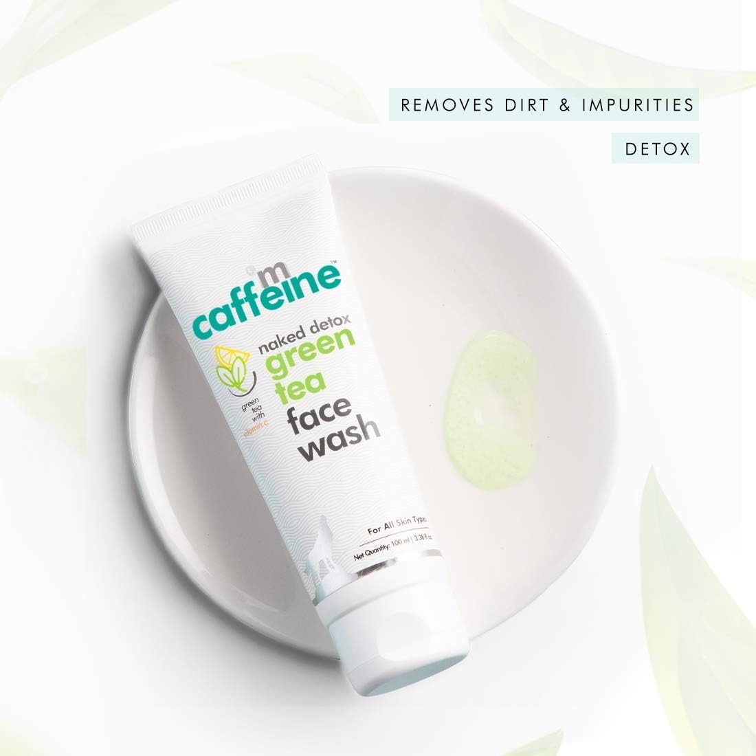 Tube of 'm caffeine green tea face wash on a white background