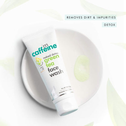 Tube of 'm caffeine green tea face wash on a white background