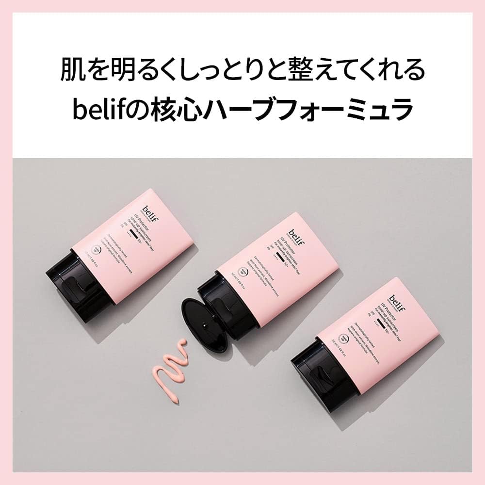 Three pink skincare products with black caps on a gray background, featuring the brand 'belif'.