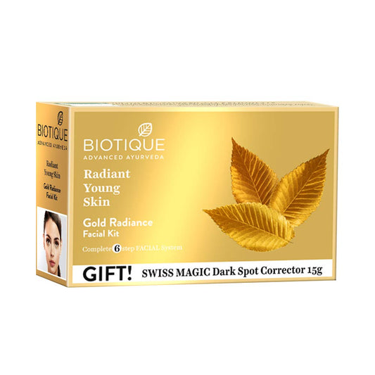 Biotique Gold Radiance Facial Kit packaging with leaves on a white background